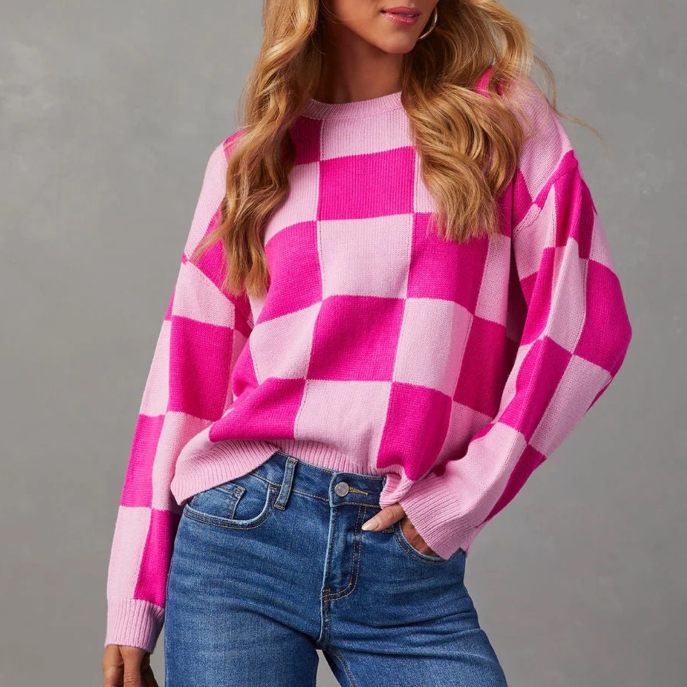 Knit Checkered Sweater in pink and fuchsia that features a relaxed fit.